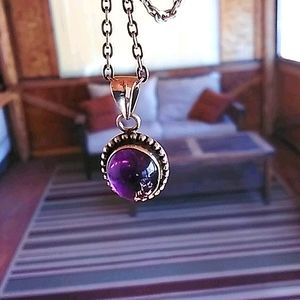 Amethyst and sterling silver pendant.
